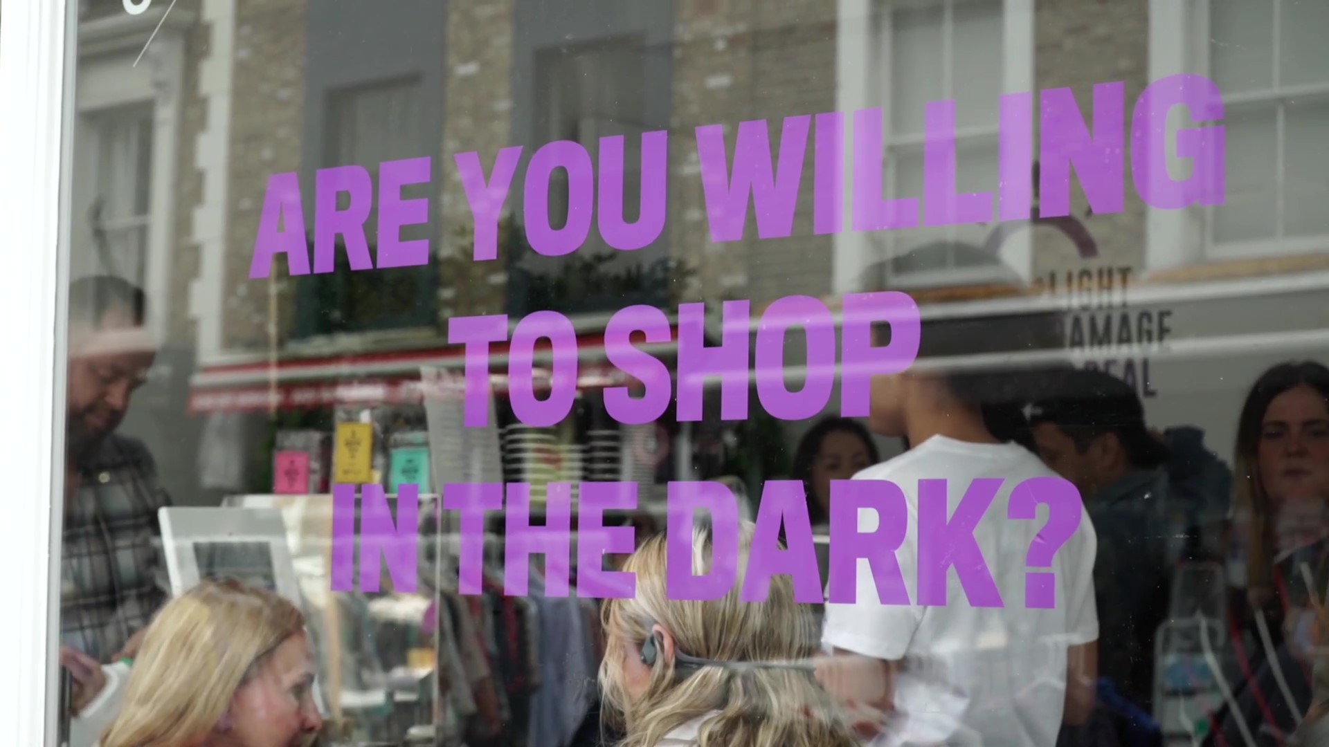 Transforming the milk industry campaign window sign stating are you willing to shop in the dark?